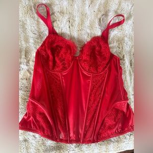 Red corset, very sexy. In sealed bags.